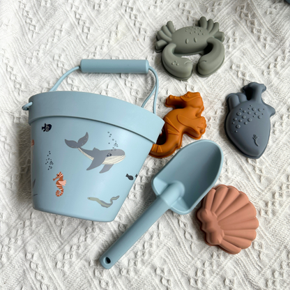 Blue silicone beach bucket set with spade and sea creature moulds
