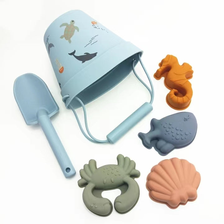 Blue silicone beach bucket set with spade and sea creature moulds