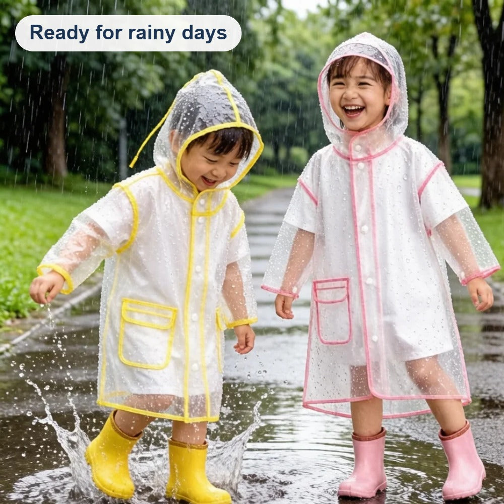 Kids splashing in puddles on a rainy day in transparent raincoats