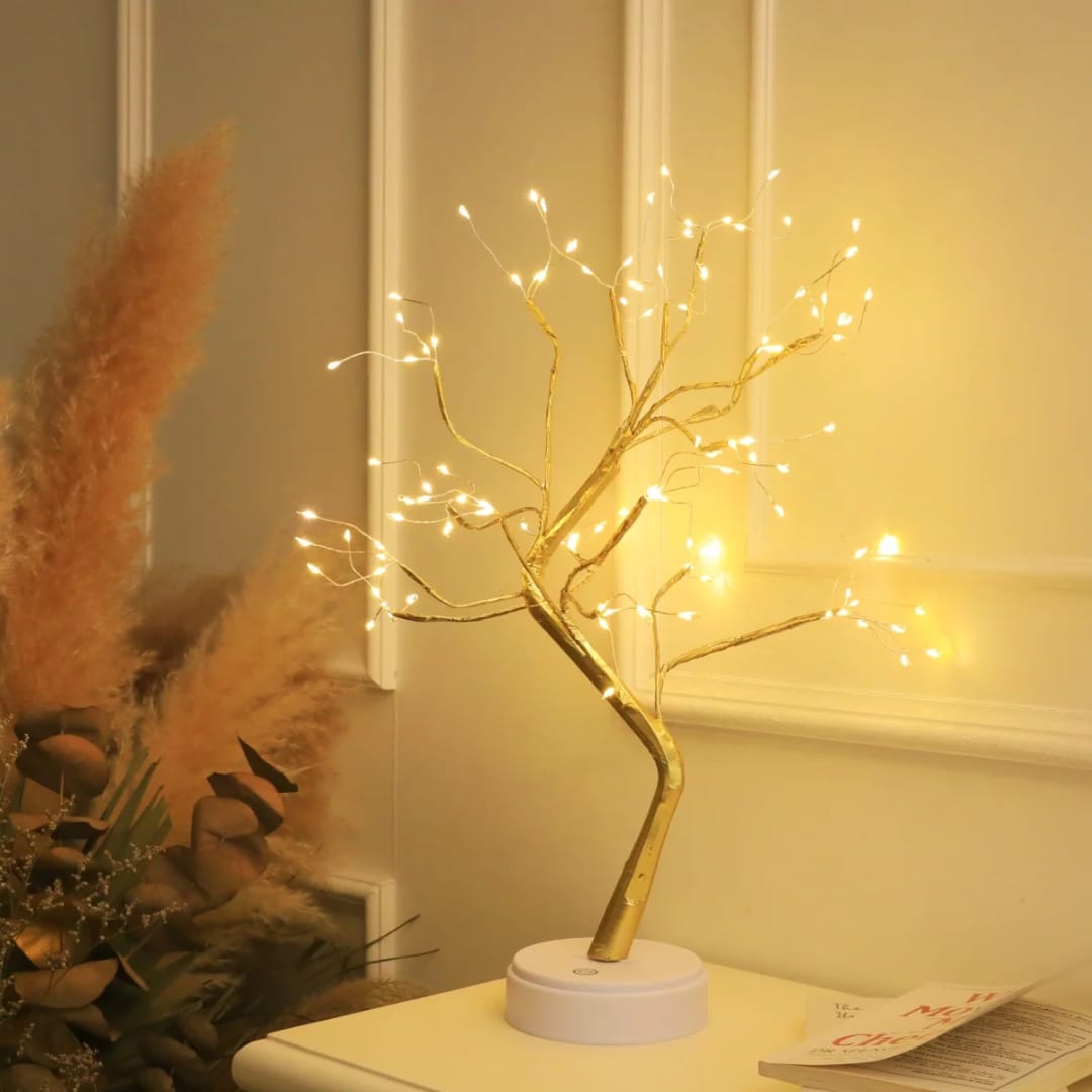 108 LED fairy light tree lamp – gold trunk on a shelf