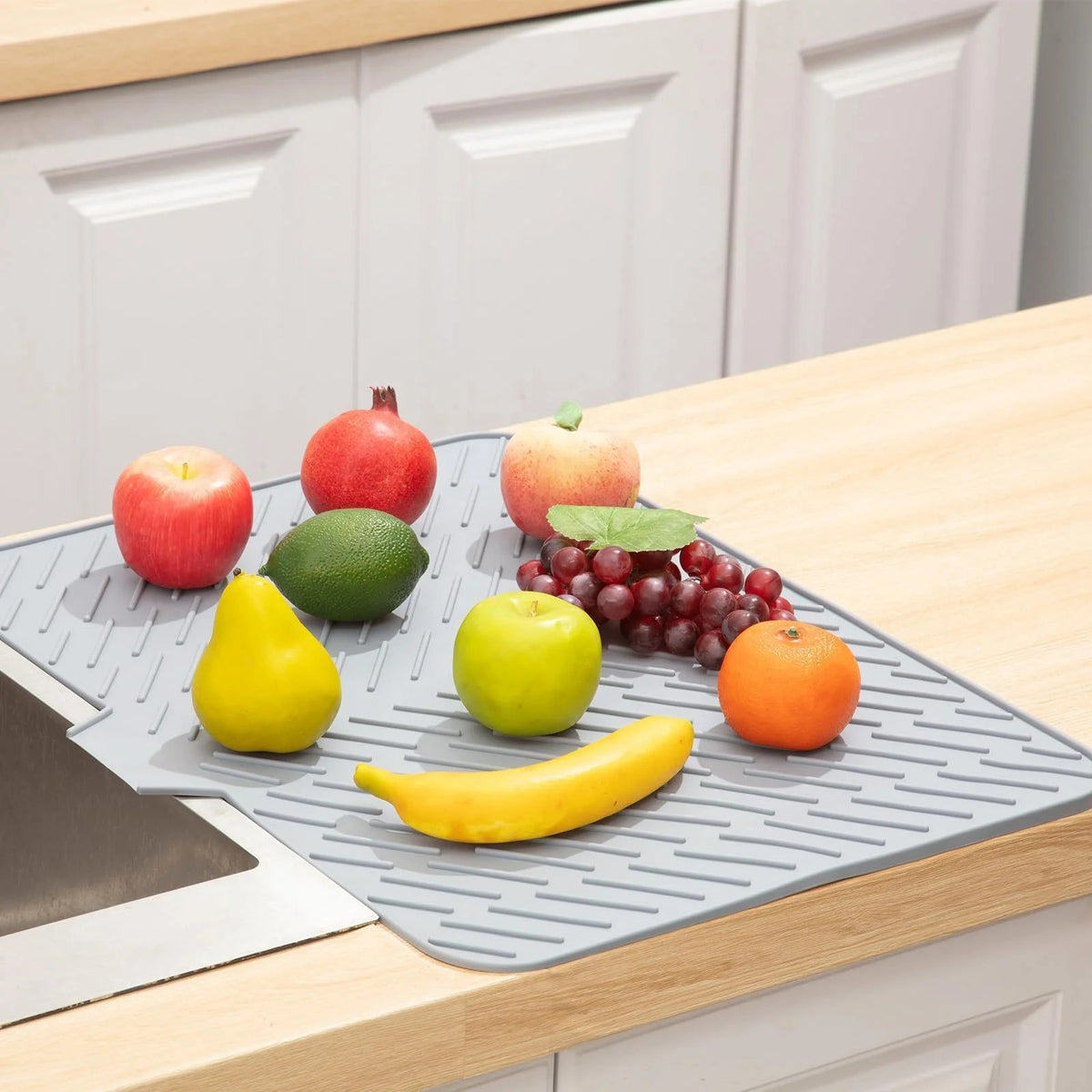 Dish drying mat on the kitchen counter next to the sink
