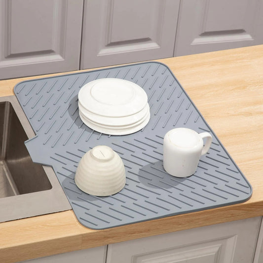 Plates, bowls and cups drying on the mat