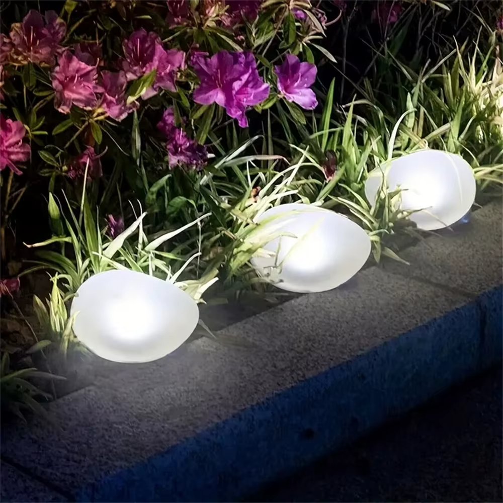 Solar glowing garden pebble stone light – view 3
