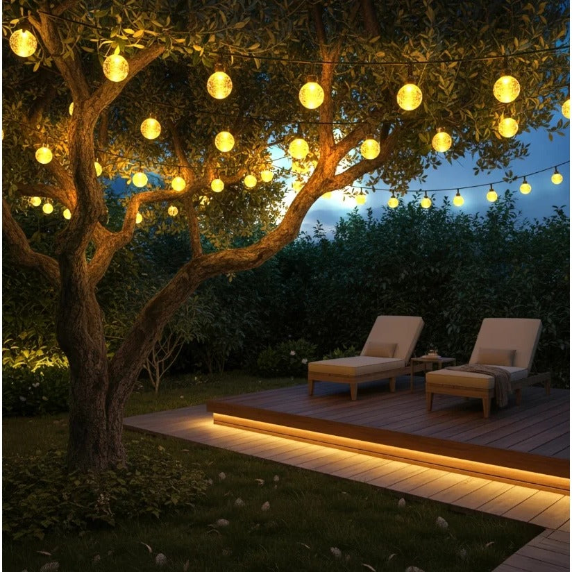 Solar string lights in a garden tree at night