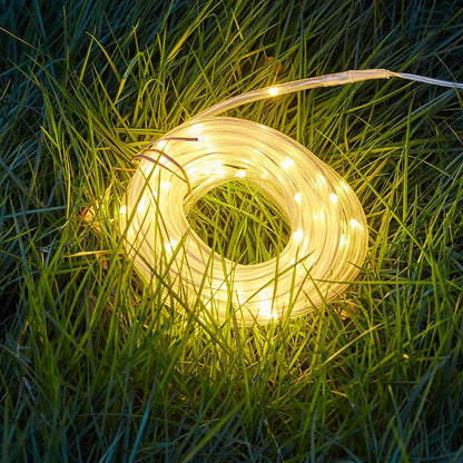 Warm white solar tube light glowing in the grass
